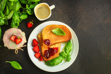 breakfast Toast, strawberry jam and coffee (tasty snack with basil, dessert). food background. top view. copy space