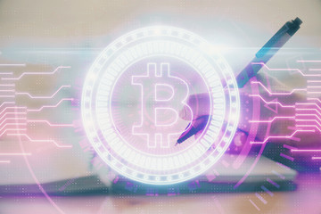 Cryptocurrency hologram over hands taking notes background. Concept of blockchain. Multi exposure