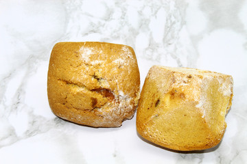 Cakes with raisin filling, sprinkled with sweet white powder