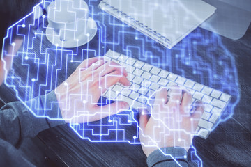 Man with computer background with brain theme hologram. Concept of brainstorm. Double exposure.