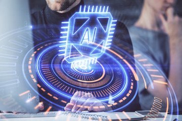Multi exposure of data internet theme hologram with man working on computer on background. Concept of innovation.