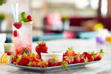 Raspberry Mojito Lemonade with lime and fresh mint in glass