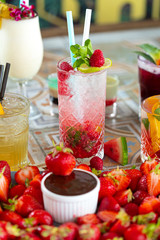 Raspberry Mojito Lemonade with lime and fresh mint in glass