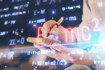 Student or teacher with mathematical and scientific formulas. Concepts of education.