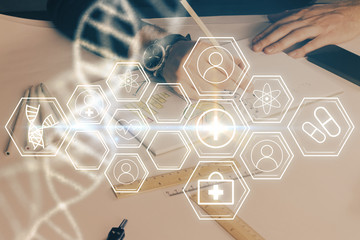 Man's hands working with notes background. Genetic engineering and gene manipulation concept.