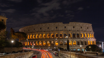 Italian monument to the Colosseum in the center of Rome in the illuminated night.