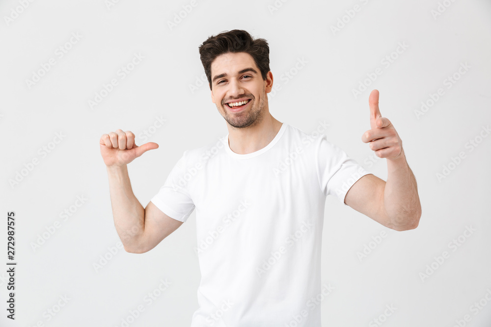 Sticker excited happy young man posing isolated over white wall background pointing to himself and you.