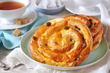 French raisin buns and cup of tea bag