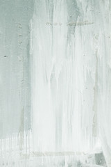 White dripping paint on a blinded window, grungy background or texture