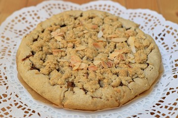 Crumble cake with integral flavour on white napkin, close up