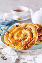French raisin buns and cup of tea bag
