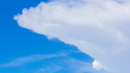 White clouds with blue sky background.