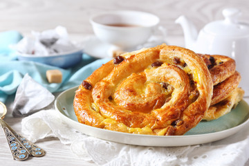French raisin buns and cup of tea bag