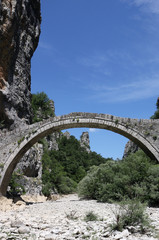 Fototapeta na wymiar kokkori old stone bridge in summer landscape Zagoria Epirus Greece