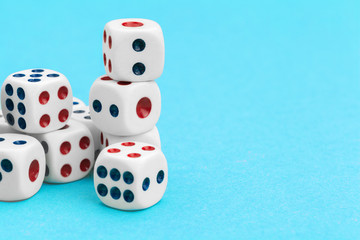 Gaming dices on blue background. Game concept.