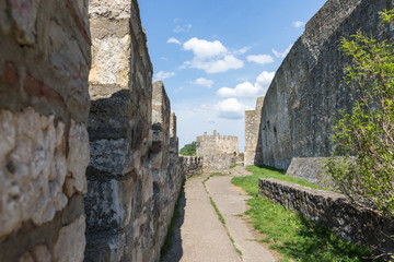 Fototapeta na wymiar The passage near the fortress wall in the ruins of the Smederevo fortress, standing on the banks of the Danube River in Smederevo town in Serbia.