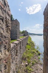 The remains  of the fortress wall and the clock tower in the ruins of the Smederevo fortress, standing on the banks of the Danube River in Smederevo town in Serbia.