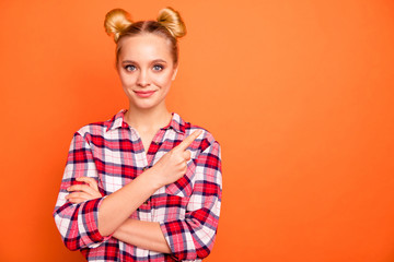 Portrait of attractive lovely pretty lady have promotion promo adverts recommend sales discount wear checked shirt plaid isolated orange background