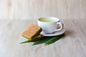 Hot tea and brake food on a wooden table