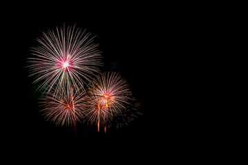 Beautiful colorful fireworks display on the sea beach, Amazing holiday fireworks party or any celebration event in the dark sky.