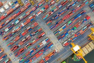 Aerial top view container cargo ship working. Business import export logistic and transportation of...