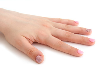 women's brush with a beautiful manicure on white background