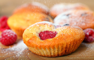 Raspberry muffin with icing sugar sprinkle
