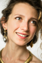 beautiful girl's face with curly hair close up