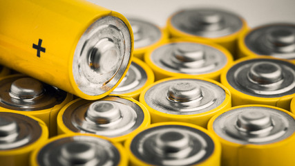 AA alkaline batteries on white background