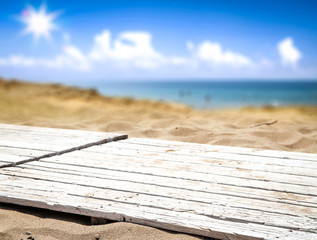 Summer background of free space and beach landscape. white wooden deck and free space for your product. 