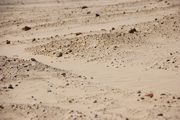 yellow sand the surface of small stones background