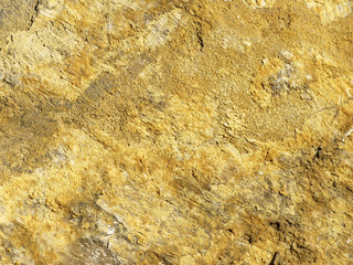 Brown background of a large piece of rock with texture detail