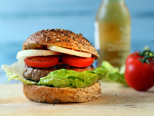 Beef burger with lettuce and tomatoes