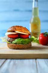 Beef burger with lettuce and tomatoes