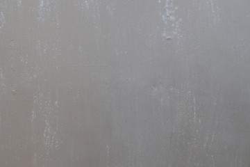 background of painted gray metal with slight smudges of rust