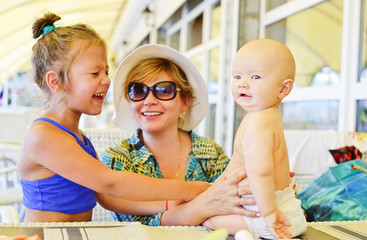 happy family in summer cafe