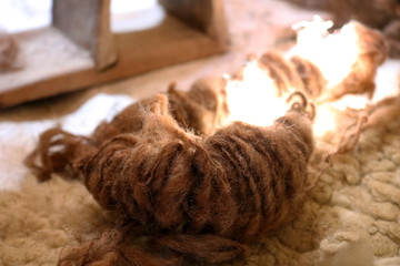 Sheep wool hand-spun. Background fluffy wool yarn