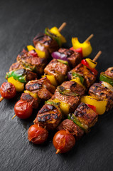 Grilled meat kebab with vegetables