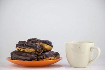 Chocolate eclairs with hot coffee