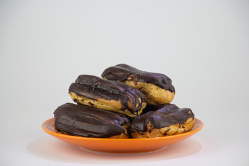 Chocolate eclairs with hot coffee