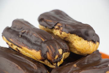 Chocolate eclairs with hot coffee