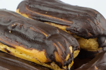 Chocolate eclairs with hot coffee