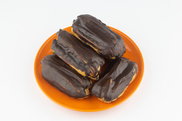 Chocolate eclairs with hot coffee