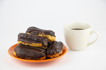 Chocolate eclairs with hot coffee