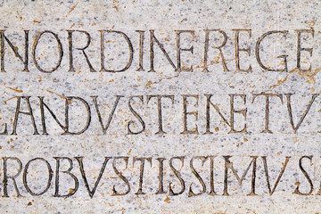 Pavia, Italy. 2017/11/11. Rythmic epitaph on the marble gravestone of the Lombard King Cuniperto (also called Cuningpert, Cunicpert, Cuninopert) who died 700AD. Castello Visconteo (Visconteo castle).