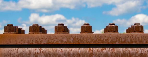 Rusty Bolt and Nut in a Metal Plate