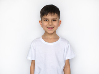 little smiling boy in white t-shirt isolated on white, t shirt design concept