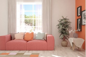 Stylish room in coral color with sofa and summer landscape in window. Scandinavian interior design. 3D illustration