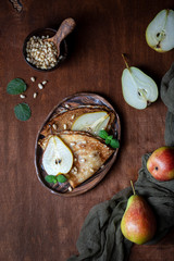 thin crepes with caramel pear and pine nuts