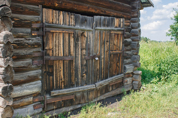 brown wooden door of old rustic barn